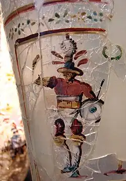 Roman glass with a painted figure of a gladiator, found at Begram, Afghanistan (once part of the Greco-Bactrian Kingdom, then under the Kushan Empire), 52–125 AD[11]