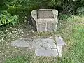 Historic District designation plaque on a piece of granite