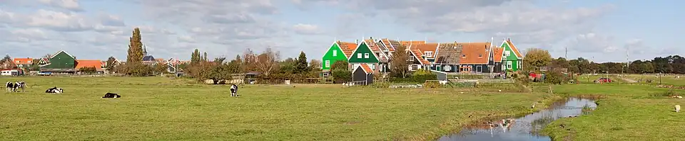 Image 6 Marken Photo: Massimo Catarinella A panoramic view of Grote Werf, a community in the municipality of Waterland, located on the Marken peninsula in the Netherlands. Marken is a tourist attraction, well-known for its characteristic wooden houses. The island is connected to the mainland by a causeway and was a separate municipality until 1991, when it was merged into Waterland. More selected pictures