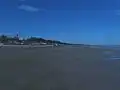 To the north of the beach