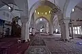 Inside the prayer hall, with mihrab and minbar on the left