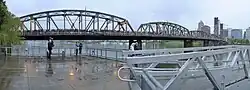 Panoramic view of a crowd of people on a bridge