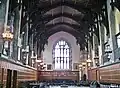 Great Hall of Hart House with coats of arms of universities around the world by Carter, 1926.