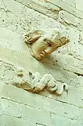 Protruded head on a wall