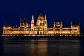 Exterior view at night from the banks of the Danube