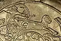 Hunter controlling his chariot from the waist, Ugarit, 15th-14th century BCE.[8]