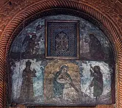 Tympanum with fresco depicting the Virgin Mary and saints