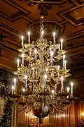 Chandelier fitted with flame-shaped light bulbs