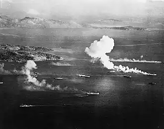 Japanese ships burning off Dublon Island, Truk Lagoon, on the first day of air strikes conducted as part of Operation Hailstone