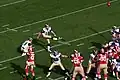 Jeff Wilkins attempts a kick for the Rams