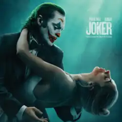 Joaquin Phoenix (as Arthur Fleck) dips Lady Gaga (as Lee Quinzel).