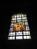 One of the windows and one of the Stations of the Cross