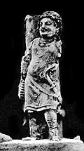 Khair Khaneh sanctuary: a donor wearing a tunic, boots and a sword.