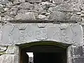 Portal with a coat of arms[13]