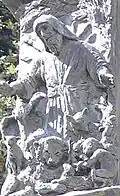 Part of the Knesset Menorah includes relief of a lamb, lion, various other animals, and a little child under a representation of Isaiah.