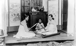 Korean women, wearing white, performing dadeumi ( 1910s)