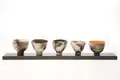 smoke-fired earthenware, sealed with wax, white clay on wood