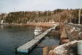 Crab fishing boat at Fisheries and Oceans Canada’s pontoons,[10] Anse aux Basques[11]