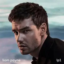 Payne glancing sideways towards a camera
