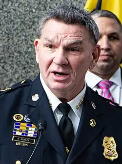 Richard Worley speaking in police uniform
