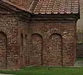 Lesenes forming blind arcades, Mausoleum of Galla Placidia, Ravenna (c. 430); dentils under the eaves.