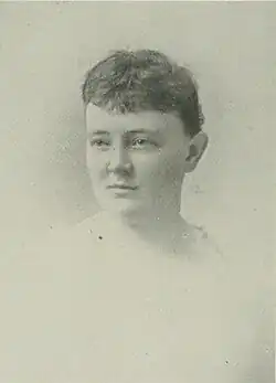 B&W portrait photo of a woman with her hair in an up-do