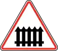 123 Level crossing with manually operated barriers for passing trains