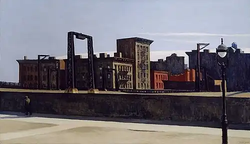 A cityscape with buildings and a bridge structure