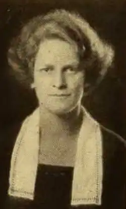 Marion Bacon, a young white woman with light hair in a bouffant style