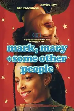 A woman and an upside-down man smile.