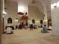 The Isyak congregational prayer about to commence in the mosque.