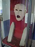 Mask and Punic steles