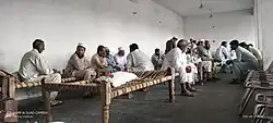 Men observing the traditional three-day prayer ritual in the Hujra — a vital Pashtun mourning tradition.