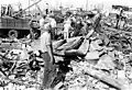 Men helping cleanup after tornado