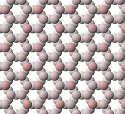 View of tetrahedral sheet of muscovite. The apical oxygen ions are tinted pink.