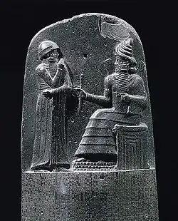 The lunette of the Code&nbsp;of&nbsp;Hammurabi (c. 1750&nbsp;BC), depicting the king receiving his law from the sun god Shamash
