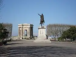 The water tower and the statue of Louis XIV.