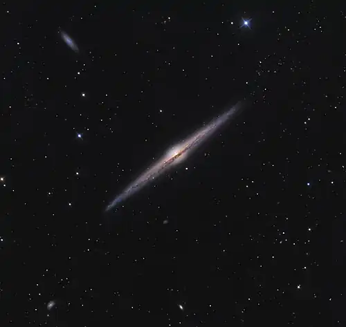 Image 15 Needle Galaxy Photograph: Ken Crawford NGC 4565 (also known as the Needle Galaxy) is an edge-on spiral galaxy about 30 to 50 million light-years away in the constellation Coma Berenices. NGC 4565 is a giant spiral galaxy more luminous than the Andromeda Galaxy, and has a population of roughly 240 globular clusters, more than the Milky Way. More selected pictures