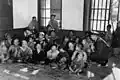New arrivals at the 5th Air Force's Seoul processing center for orphans, before the evacuation to Jeju Island. Chaplain COL Wallace Wolverton is at left and Chaplain LTC Russell Blaisdell is at right