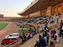 Seats at a stadium with a few thousand people.