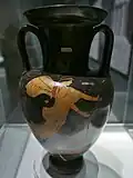 A flying Nike holding out a tainia in both hands (on the opposite side of the vase a victor with wreaths and tainias); neck-amphora, London, British Museum E312 (c. 500–450 BC).[123]