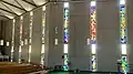 Northern wall with stained glass windows.