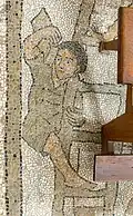 A boy climbs a ladder as part of the construction of the tower of Babel.