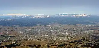 Kōriyama in front of the Ōu Mountains. The Ōu Mountains form the western border of Nakadōri
