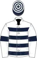 White, dark blue hoops and armlets, dark blue and white hooped cap