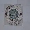 Marble disc on the facade