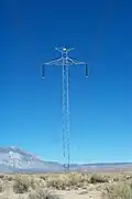 The Pacific DC Intertie along a service road paralleling U.S. Highway 395. Many of the towers of the Intertie are of this simple, slender design