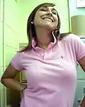 Image 134Woman wearing a polo shirt with a popped collar. (from 1990s in fashion)