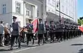 Policja officers marching in parade uniform on 3 May Constitution Day