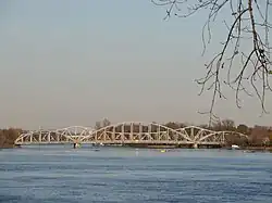 Two non-identical steel frame bridges side by side.